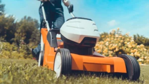 Orange lawnmower used for DIY lawn maintenance